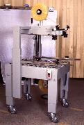 carton sealing machine with bottom drive