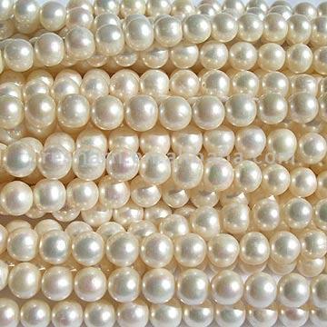  White Near Round Pearl Strands